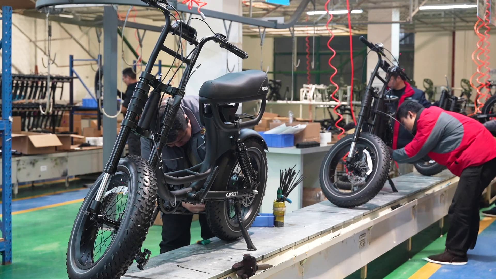 ZUMIBIKE technician adjusting an engineering electric bike prototype